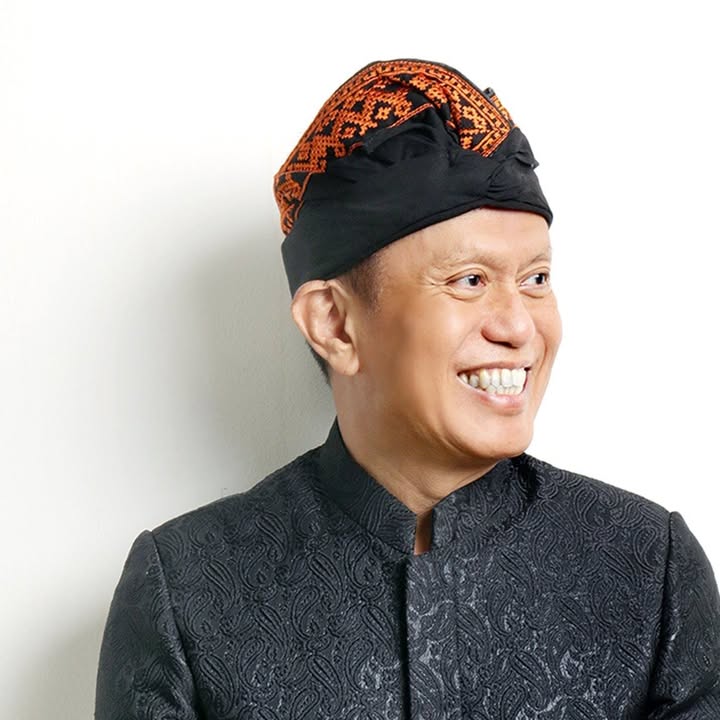 Portrait of Tommyanto Kandisaputra in traditional Indonesian attire
